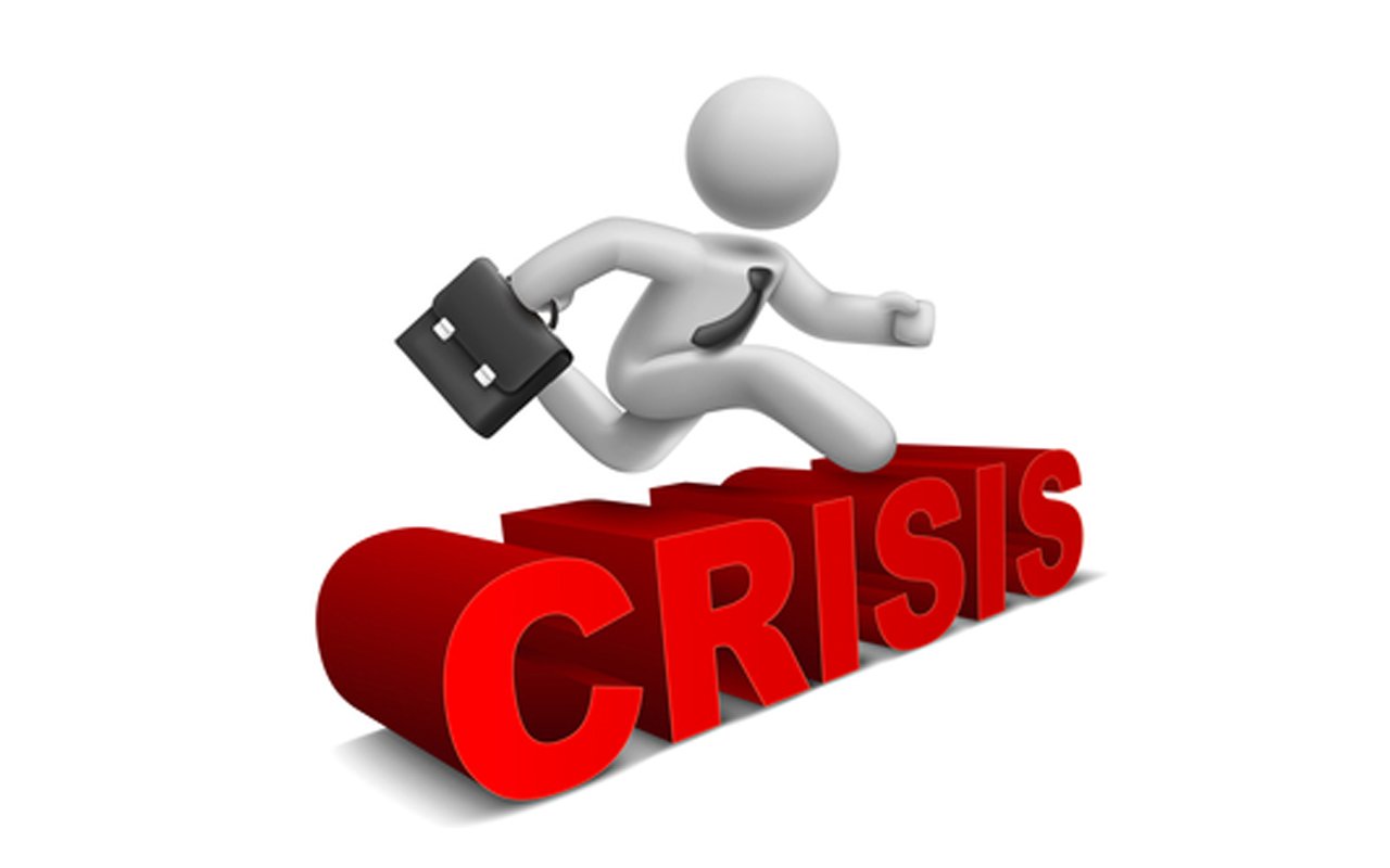 3d businessman jumping over 'crisis' word