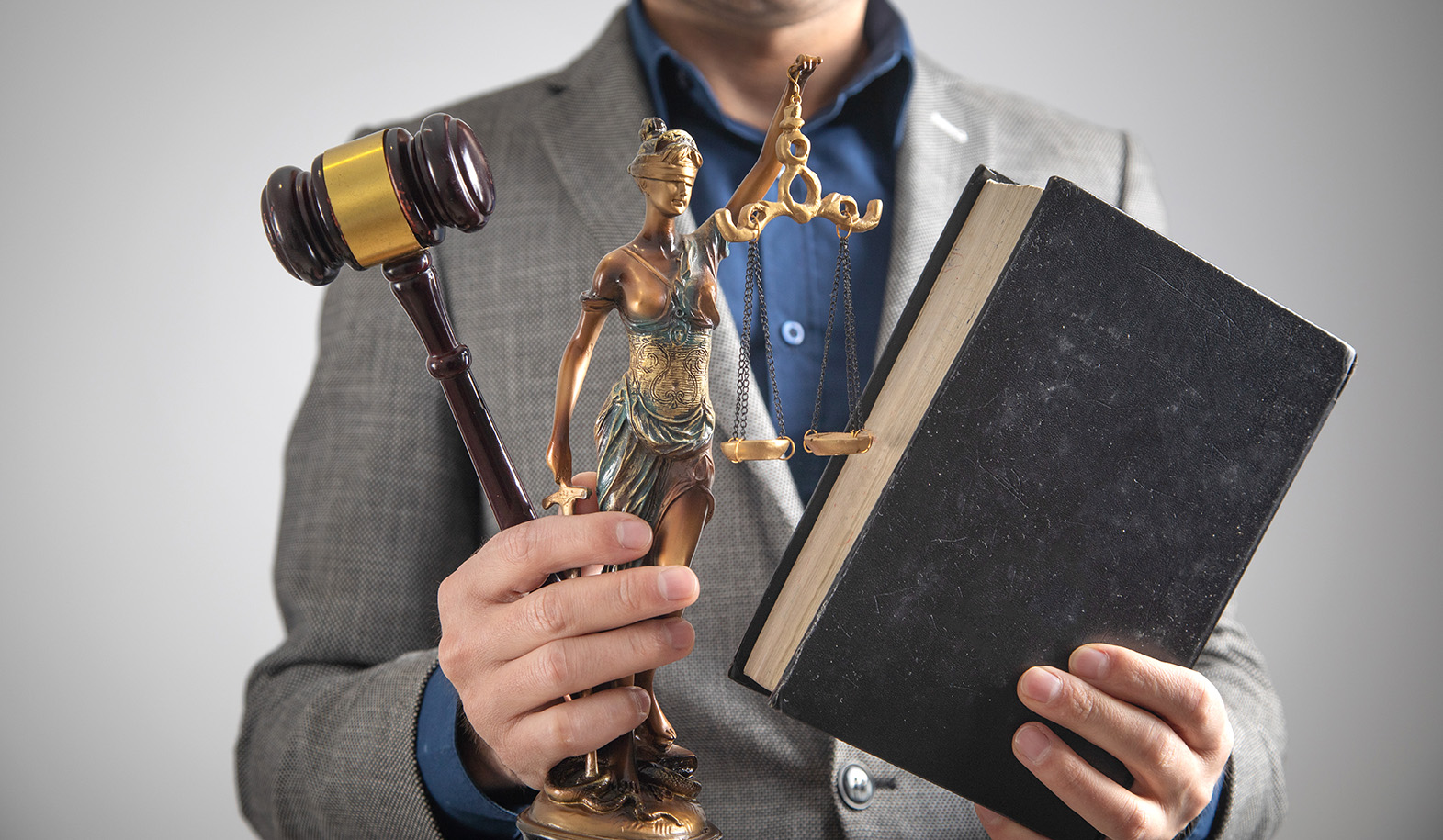 Lawyer holding Judge gavel, book.
